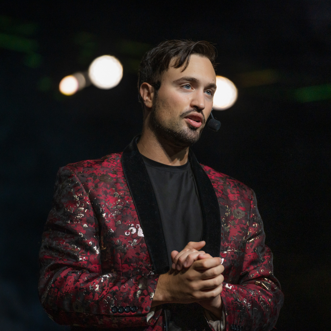 Aaron is happy while performing on stage