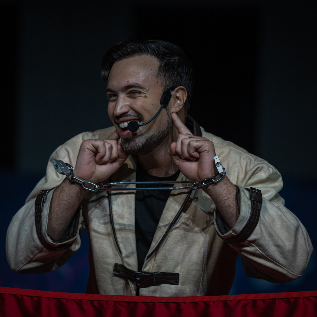 Aaron Matthews performing a magic trick