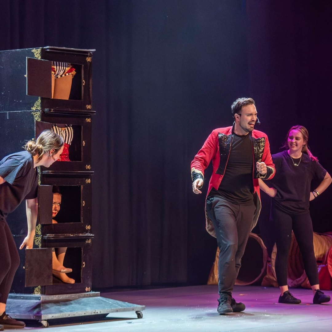 Aaron Matthews sharing a joyful moment with an audience member